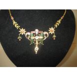 An Indian high carat gold necklace set with large central diamond with emeralds and rubies and