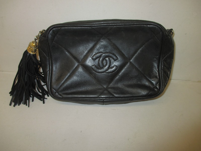 A 1980's leather clutch bag by Coco Chanel, number 0749038