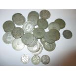 A quantity of silver shillings and 3d pieces