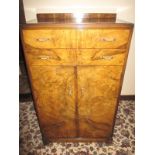 A 1930s Art Deco dressing cabinet with 2 drawers over cabinet base