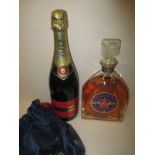 A bottle of Kings Crest Whisky and a bottle of vintage Piper champagne