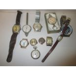 A quantity of vintage wristwatches and map measuring wheels, to include gold cased examples