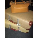 Two vintage 'Revelation' suit cases