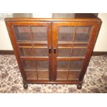 A small 2 door glazed display cabinet