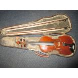 A Mid 19th century violin in hard case with 2 bows, label reads ELEVE D'ALDRIC PARIS