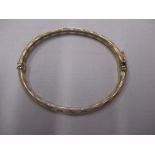 A 9ct gold bangle, approx weight 5g