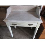 An antique marble topped wash stand