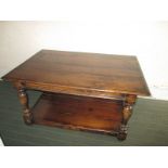 A dark oak two tier coffee table