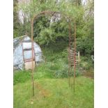 A large Edwardian iron rose arbour