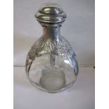 A vintage silver mounted Haig Whisky bottle