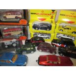 A quantity of die cast vehicles to include Vega coaches and Corgi London Taxis