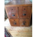 A vintage 4 drawer card cabinet