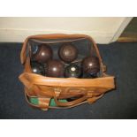 Four sets of 4 lawn bowls in leather bag, to include one set by 'Jaques' of London