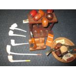 A quantity of vintage pipe smoking items to include clay pipes