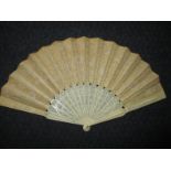 A late 19th century ivory and lace fan