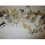 A quantity of Wade wymsies to include disney examples and other ceramic figures