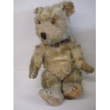 A late 1940's plush teddy bear