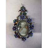 A 19th Century silver pendant with semi precious stones and enamel and central hand painted