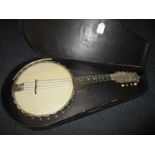 A vintage 8 string banjo in case by John Gray & sons London, No. G6274