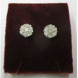 A pair of 9ct gold earrings set with a total diamond weight of 1ct , with a Gemporia certificate