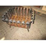 A wrought iron fire basket