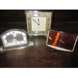 Two art deco desk clocks and a 1960s example