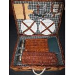 A picnic set in wicker basket
