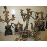 A quantity of plated items to include a 4 piece tea set and a 5 branch candelabra