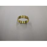 An 18ct gold band ring