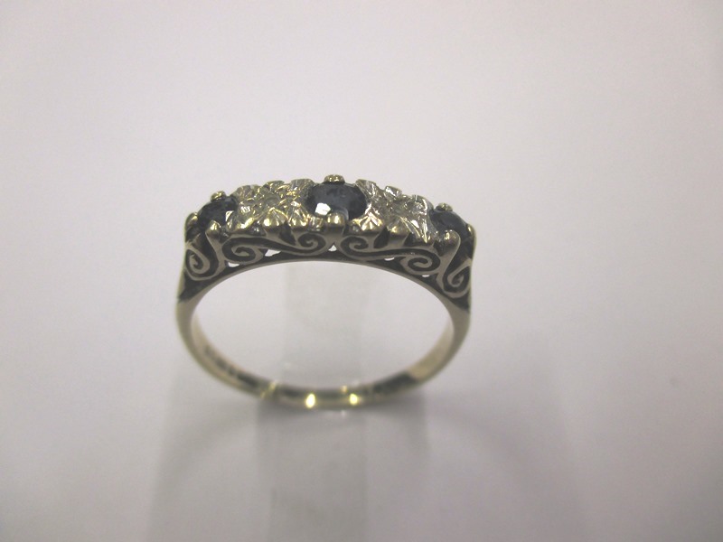 A 9ct gold diamond and sapphire ring