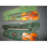 A cased vintage violin and bow and a student violin in case
