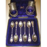 A boxed set of sterling silver spoons and 4 silver napkin rings, approx weight 133g