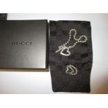 A sterling silver bracelet and ring by Gucci, in original retailers box