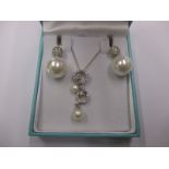 A silver necklace & matching earring set