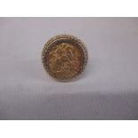 A 9ct gold sovereign ring, the coin dating 1909