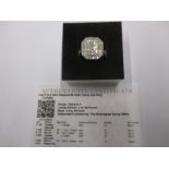 A limited edition Tomas Rae 9ct gold ring set with a total diamond weight of .75ct, with