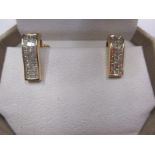 A pair of 14ct gold earrings with 66 illusion set diamonds, with certificate.