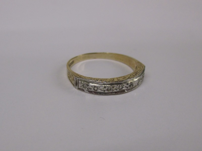 A 9ct gold and diamond band ring