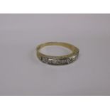 A 9ct gold and diamond band ring