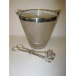 A frosted glass ice bucket with plated mounts and tongs