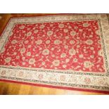 A vintage rug with red border pattern