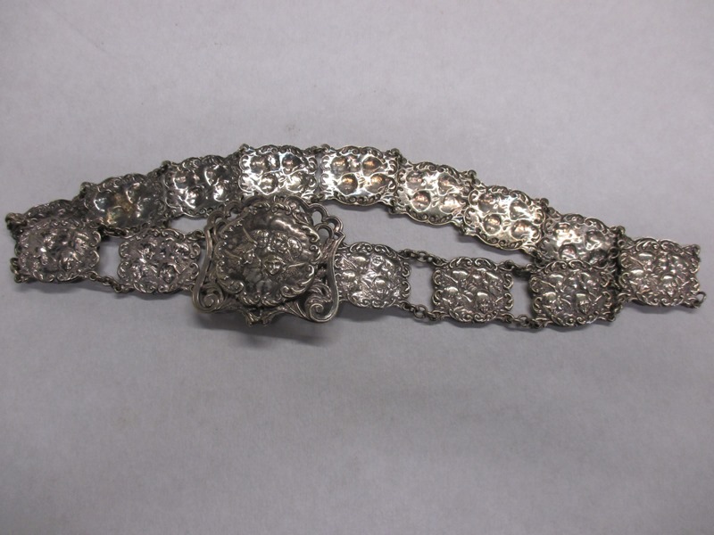 A silver plated Nurses belt depicting Reynold's angles