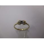 A 9ct gold diamond and sapphire stylised ring