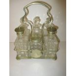 An early 20th century 6 bottle cruet set on plated stand