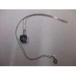 A 9ct white gold necklace with diamond and mystic topaz pendant