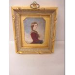 A 19th Century portrait miniature on ivory? Of a seated young lady in later frame