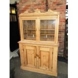 A 19th century natural pine glazed top kitchen dresser