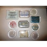 A quantity of 19th Century and later advertising paper weights and an ashtray