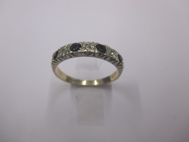 A 9ct gold diamond and sapphire band ring