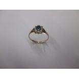 A 9ct gold diamond and sapphire ring